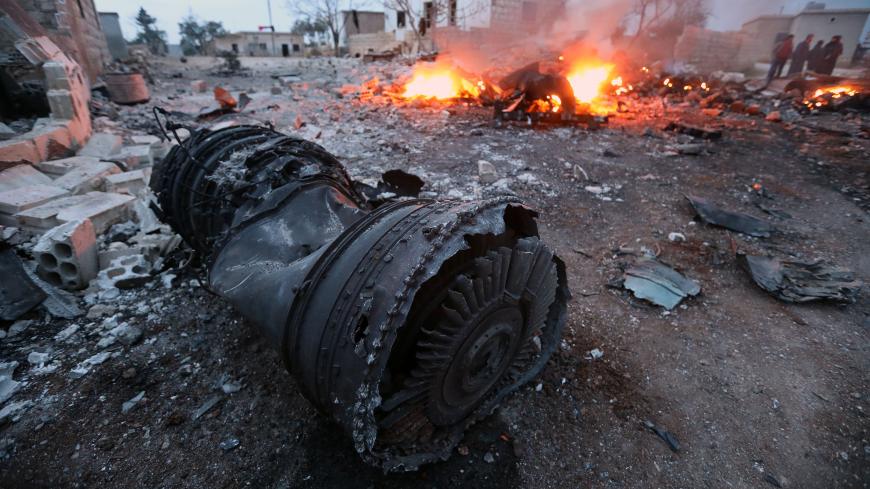A picture taken on February 3, 2018, shows smoke billowing from the site of a downed Sukhoi-25 fighter jet in Syria's northwest province of Idlib.
Rebel fighters shot down a Russian plane over Syria's northwest Idlib province and captured its pilot, the Syrian Observatory for Human Rights said. 
 / AFP PHOTO / OMAR HAJ KADOUR / The erroneous mention[s] appearing in the metadata of this photo by OMAR HAJ KADOUR has been modified in AFP systems in the following manner: [in Syria's northwest province of Idlib.