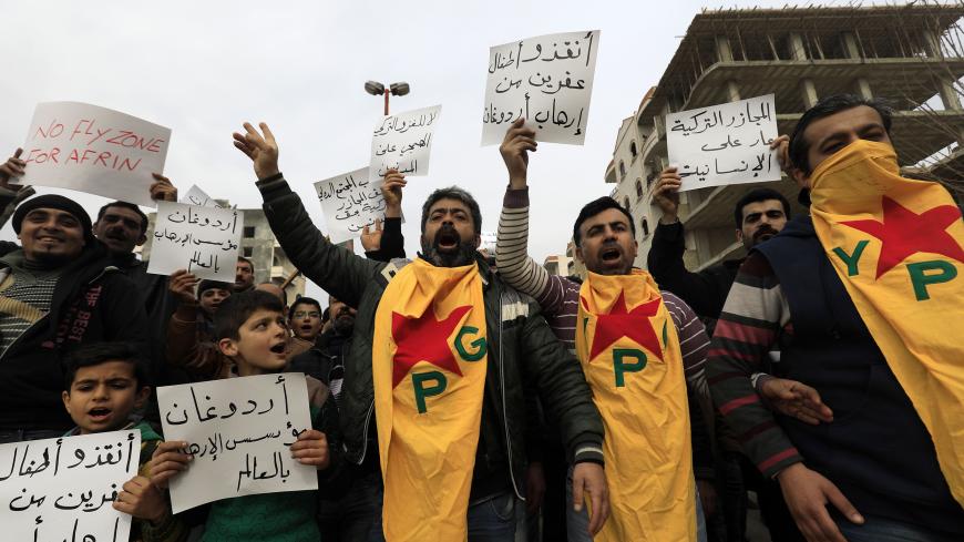Syrian Kurds march in the northern Syrian city of Afrin during a demonstration on February 4, 2018 denouncing the military operation by the Turkish army against the Kurdish YPG forces in Syria's Kurdish enclave. / AFP PHOTO / DELIL SOULEIMAN        (Photo credit should read DELIL SOULEIMAN/AFP/Getty Images)