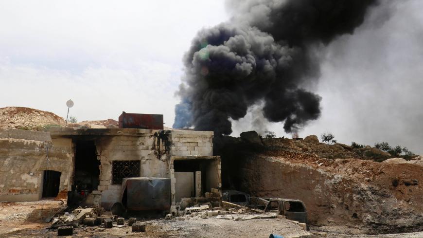 Smoke rises from an emergency service point after an airstrike at the rebel-held village of Maar Zita in Idlib province, Syria April 27, 2017. REUTERS/Ammar Abdullah - RC124087CB50