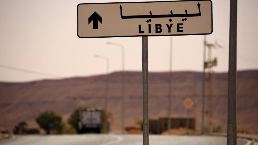 A road sign shows the direction of Libya near the border crossing at Dhiba, Tunisia April 11, 2016. Tunisia's 2011 uprising created fertile ground for jihadist recruiters. Hundreds of Islamist militants were freed from prison as part of an amnesty for those detained under Ben Ali. Ultra-conservative salafists began to flex their muscle, seizing control of mosques and clashing with secularists. As Tunisia's politics have stabilised, the government has reasserted control, taking back mosques, banning the loc