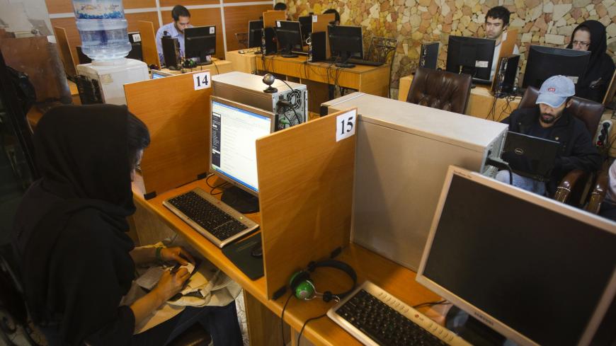 Customers use computers at an internet cafe in Tehran May 9, 2011. Websites like Facebook, Twitter, YouTube and countless others were banned shortly after the re-election of Iran's President Mahmoud Ahmadinejad and the huge street protests that followed. Seen by the government as part of a "soft war" waged by the enemies of the Islamic Republic, social networking and picture sharing sites were a vital communication tool for the anti-Ahmadinejad opposition -- more than a year before they played a similar rol