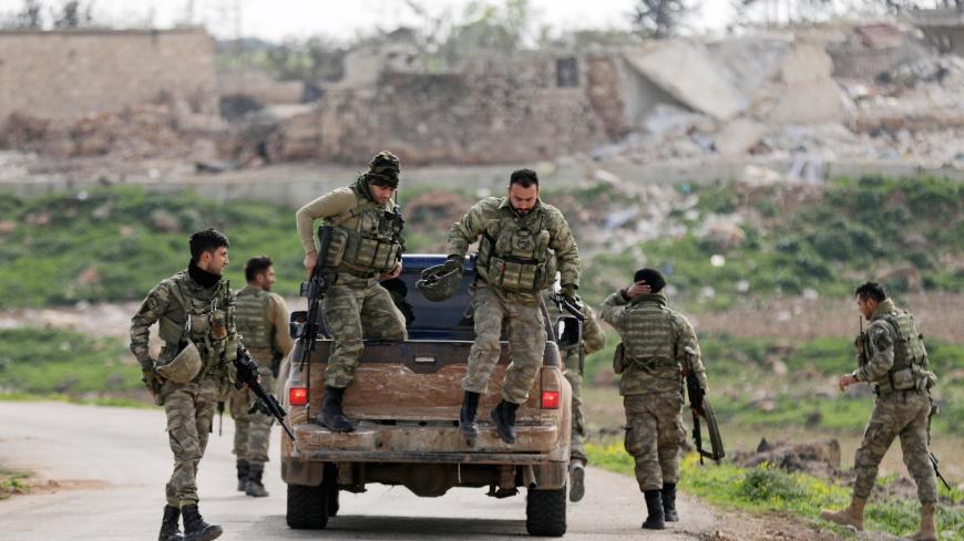 Turkish-backed Free Syrian Army fighters are seen in Maryamayn in eastern Afrin, Syria March 11, 2018. REUTERS/Khalil Ashawi - RC18EE8048A0