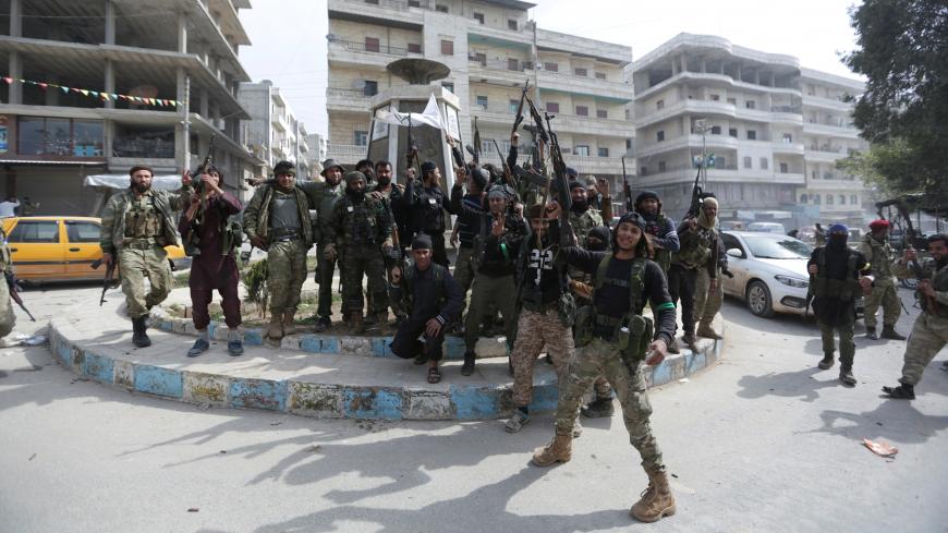 Turkish-backed Free Syrian Army members are celebrating in Afrin, Syria March 18, 2018. REUTERS/ Khalil Ashawi - RC146FD244D0
