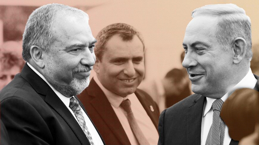 Israeli Prime Minister Benjamin Netanyahu (R) and Israel's defense minister, Avigdor Lieberman (L) during a special Cabinet meeting to mark Jerusalem Day in 1Ein Lavan Spring located in the outskirts of Jerusalem 02 June 2016. REUTERS/Abir Sultan/Pool - S1AETHOLEQAC