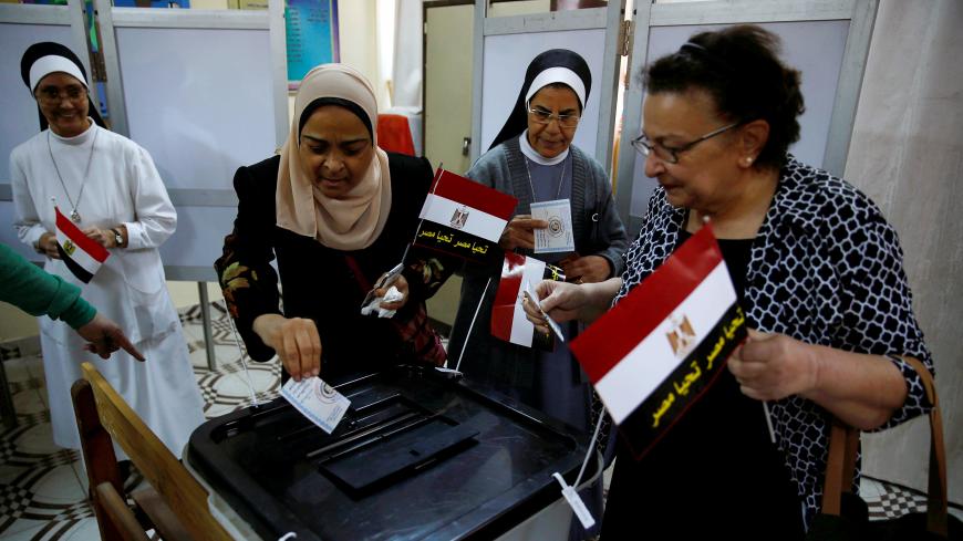 Egyptians cast their votes at a polling station during the presidential election in Cairo, Egypt, March 26, 2018. REUTERS/Amr Abdallah Dalsh TPX IMAGES OF THE DAY - RC19C55FEBE0