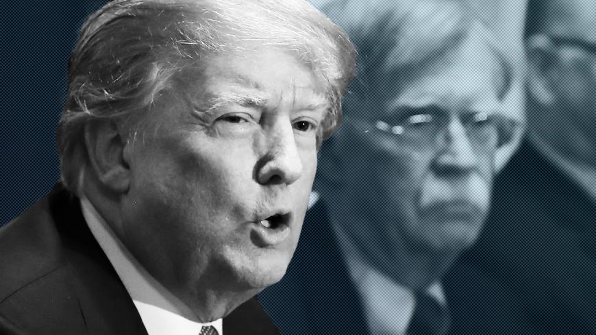 WASHINGTON, DC - APRIL 09: U.S. President Donald Trump is flanked by National Security Advisor John Bolton as he speaks about the FBI raid at his lawyer Michael Cohen's office, while receiving a briefing from senior military leaders regarding Syria,  in the Cabinet Room, on April 9, 2018 in Washington, DC.  The FBI raided the office of Michael Cohen on Monday as part of the ongoing investigation into the president's administration. (Photo by Mark Wilson/Getty Images)