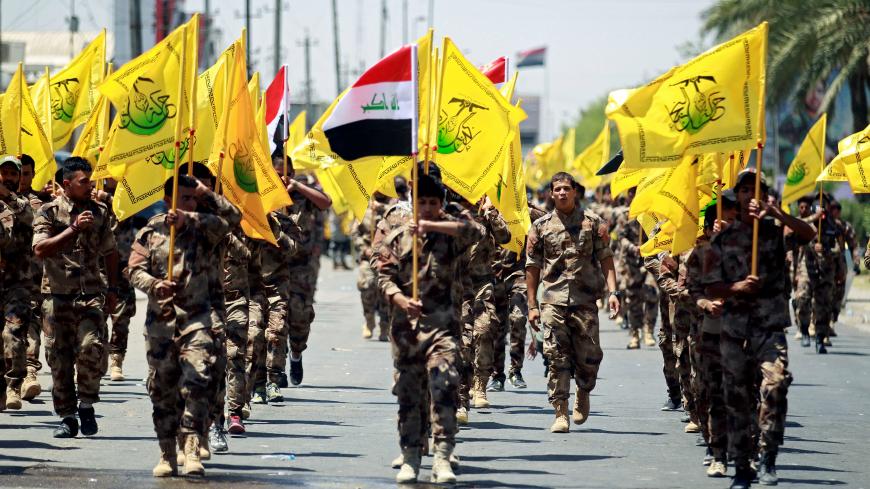 Iraqi Shi'ite Muslims from Hashid Shaabi (Popular Mobilization) march during a parade marking the annual al-Quds Day, or Jerusalem Day, in Baghdad, Iraq June 23, 2017. REUTERS/Khalid al Mousily - RC160C330360