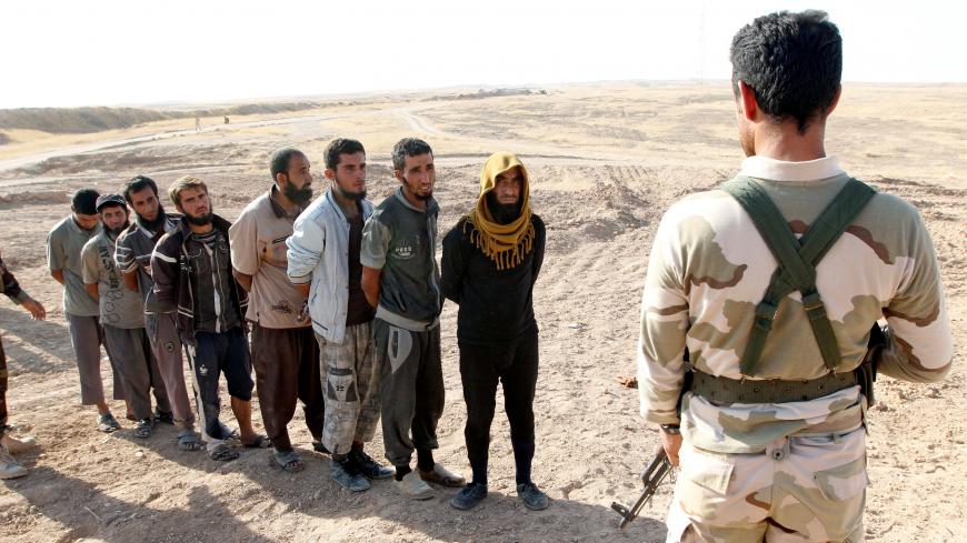 Kurdish Peshmerga forces detain Islamic State militants southwest of Kirkuk, Iraq October 5, 2017. REUTERS/Ako Rasheed - RC168144D210