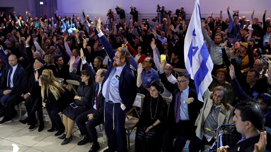 Likud party members vote during a Likud Central Committee meeting in Airport City, Israel December 31, 2017. REUTERS/Amir Cohen - RC15A92D2000