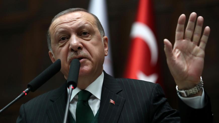 Turkish President Tayyip Erdogan addresses members of parliament from his ruling AK Party (AKP) during a meeting at the Turkish parliament in Ankara, Turkey, March 6, 2018. REUTERS/Umit Bektas - RC1F7DE4C8E0