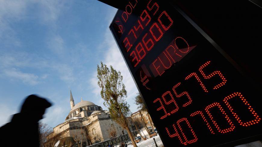 A board showing the currency exchange rates of the U.S. dollar and the Euro against Turkish lira is on display at a currency exchange office in Istanbul, Turkey, January 11, 2017. REUTERS/Murad Sezer - RC111EF016F0