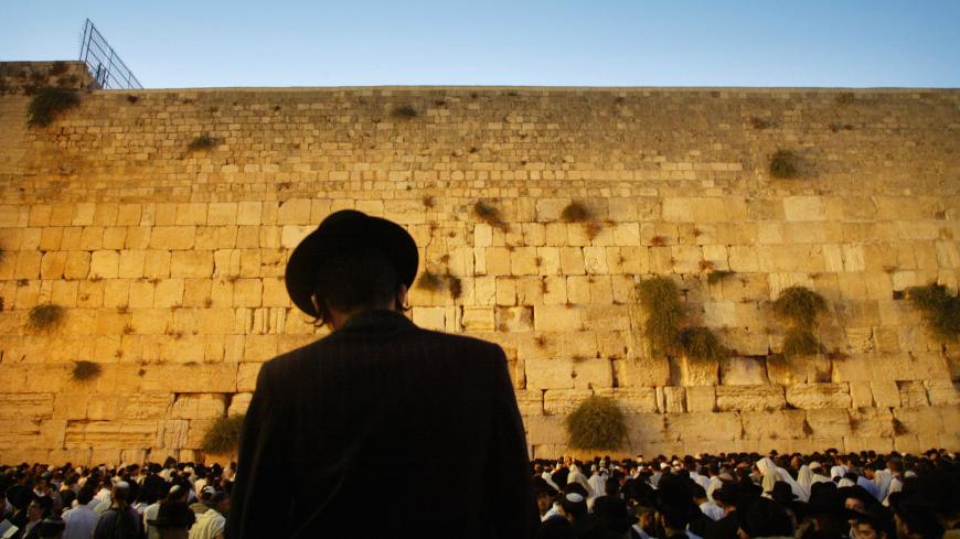Thousands of Jews pray on the plaza before the Western Wall, Judiasm's
holiest site, as they recite prayers marking the solemn fasting day of Tisha
B'Av early August 7, 2003. The holy day marks the destruction of both the
First and Second ancient Jewish Temples which stood on the Temple Mount,
behind the Western Wall. NO RIGHTS CLEARANCES OR PERMISSIONS ARE REQUIRED FOR THIS IMAGE REUTERS/Gil Cohen Magen
SHE/MA - RP4DRIFRKLAA
