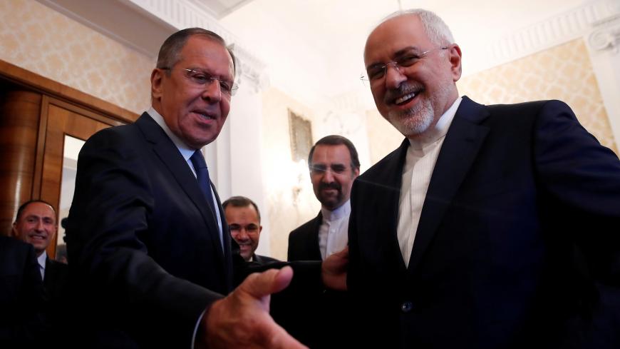 Russian Foreign Minister Sergei Lavrov invites his Iranian counterpart Mohammad Javad Zarif to have a seat during their meeting in Moscow, Russia May 14, 2018. REUTERS/Maxim Shemetov - RC1CB134A5F0