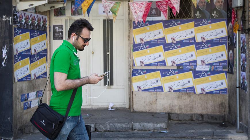 A man uses his smartphone to follow election news in Tehran, Iran May 17, 2017. REUTERS/TIMA ATTENTION EDITORS - THIS IMAGE WAS PROVIDED BY A THIRD PARTY. FOR EDITORIAL USE ONLY. - RC18C545D440