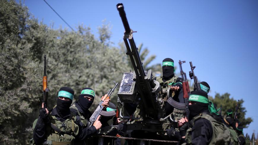 Palestinian Hamas militants attend a military drill in preparation to any upcoming confrontation with Israel, in the southern Gaza Strip March 25, 2018. REUTERS/Ibraheem Abu Mustafa - RC1B884125E0