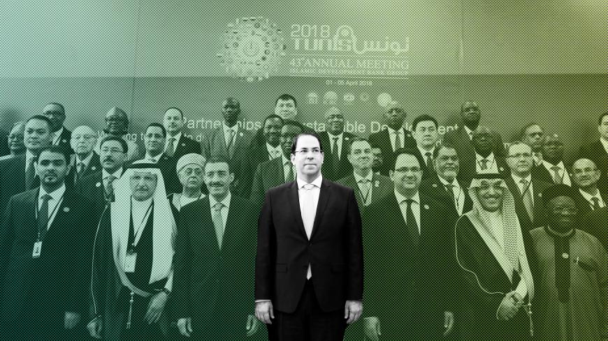 Tunisia's Prime Minister Youssef Chahed (C) poses during a group photo at the 43rd Annual Meeting of the Islamic Development Bank Group (IsDB Group) in Tunis, Tunisia April 4, 2018. REUTERS/Zoubeir Souissi - RC1CF686D080