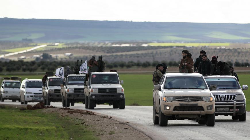 Turkish-backed Syrian rebels ride on trucks at Manbij countryside, Syria December 28, 2018. REUTERS/Khalil Ashawi - RC12E3699180