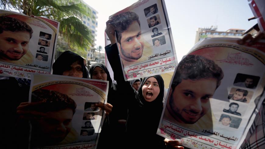 Palestinian families of those killed in violence in the Gaza Strip, protest in support of executing criminals outside a conference being held by non-governmental organisations on the occasion of the World Day Against the Death Penalty, in Gaza City, on October 9, 2013. The Gaza Strip's Islamist rulers Hamas hanged a prisoner today who had been convicted of murder, its interior ministry said, despite international calls for a halt to executions. Under Palestinian law, collaboration with Israel, murder and dr