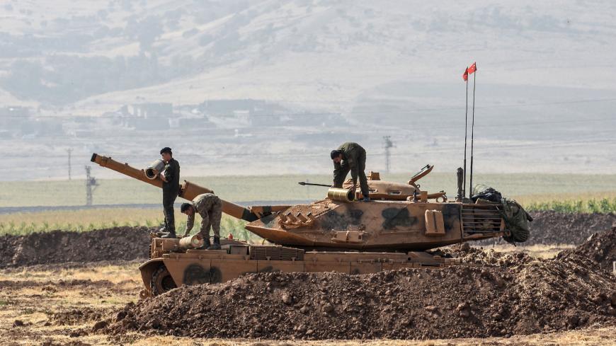Turkish soldiers conduct military exercises near the Habur crossing gate between Turkey and Iraq on September 27, 2017 in the Silopi district, southeast Turkey. 
Iraqi soldiers on September 26 took part in a Turkish military drill close to the Iraqi border on Tuesday, an AFP photographer said, a day after Iraq's Kurdish region held a vote on independence.  / AFP PHOTO / ILYAS AKENGIN        (Photo credit should read ILYAS AKENGIN/AFP/Getty Images)