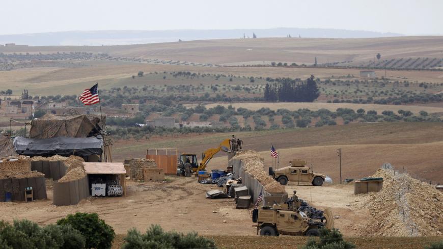 A picture taken on May 8, 2018 shows vehicles and structures of the US-backed coalition forces in the northern Syrian town of Manbij. - The Syrian Observatory for Human Rights, a Britain-based monitor with sources on the ground, says around 350 members of the US-led coalition -- mostly American troops -- are stationed around Manbij. (Photo by Delil souleiman / AFP)        (Photo credit should read DELIL SOULEIMAN/AFP/Getty Images)