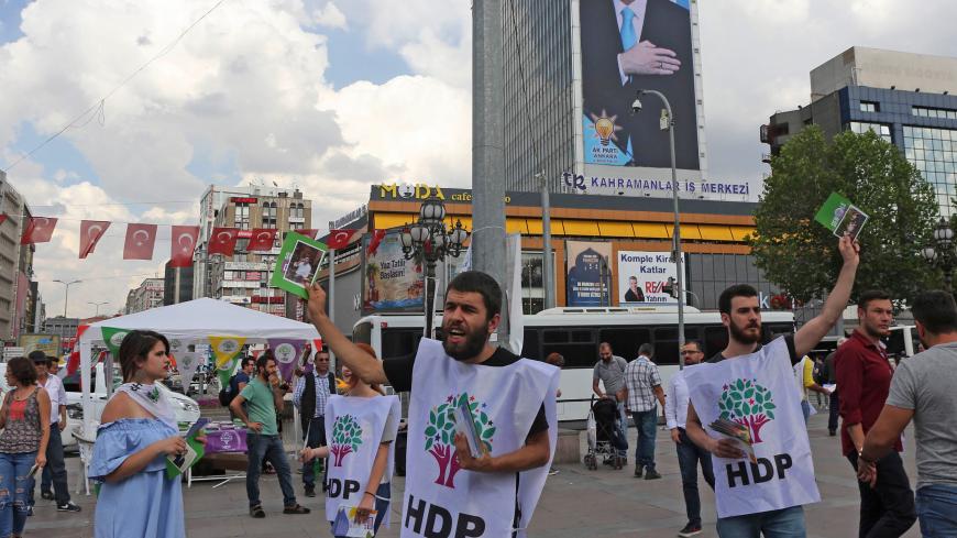 Supporters of pro-Kurdish Peoples' Democratic Party (HDP) distribute brochures on June 7, 2018 in Ankara, ahead of the Turkish presidential elections. (Photo by ADEM ALTAN / AFP) (Photo credit should read ADEM ALTAN/AFP/Getty Images)