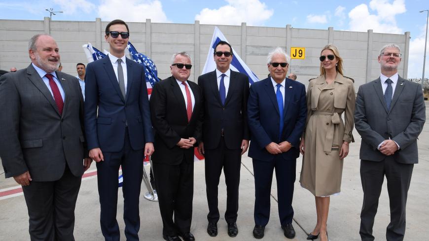 White House senior advisor Ivanka Trump (2nd-R), U.S. Ambassador to Israel David Friedman (3rd-R), U.S. Treasury Secretary Steven Mnuchin (C), U.S. Deputy Secretary of State John Sullivan (3rd-L), White House Senior Advisor Jared Kushner (2nd-L) and Israeli officials pose for a photo upon arrival at the Ben Gurion International Airport, near Lod, Israel May 13, 2018. Courtesy David Azagury/U.S. Embassy Tel Aviv/Handout via REUTERS    ATTENTION EDITORS - THIS IMAGE WAS PROVIDED BY A THIRD PARTY. - RC1E15DFCD