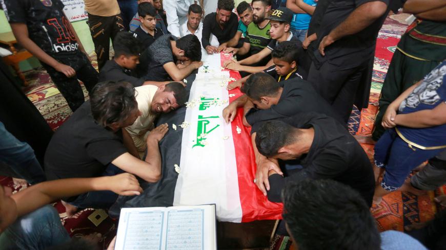 Mourners attend the funeral of the security men who were kidnapped and killed by Islamic State militants, in Kerbala, Iraq June 28, 2018. REUTERS/Alaa al-Marjani - RC18ED3C92D0
