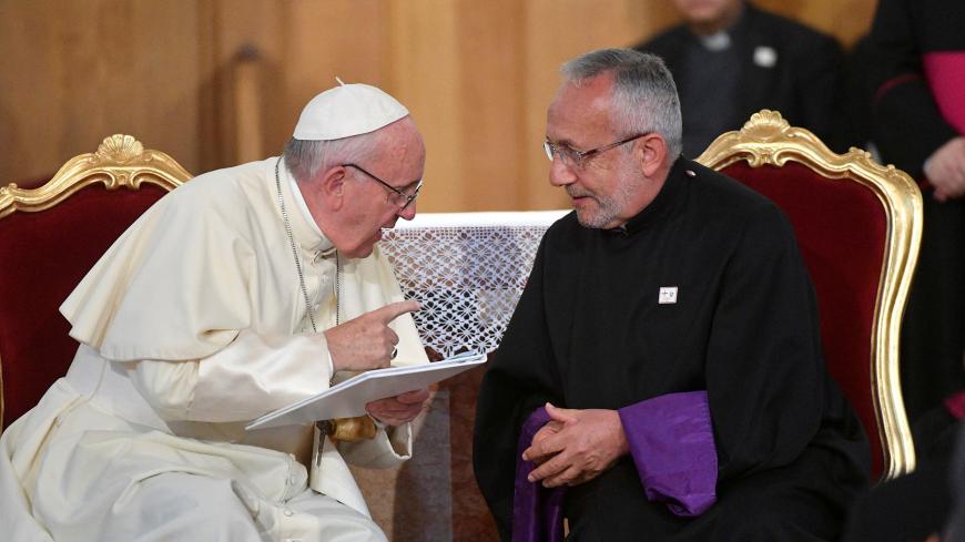 Pope Francis (L) talks with Patriarch Louis Raphael I Sako during a meeting with priests, seminarists, and pastoral care agents at the Church of the Assumption in Tbilisi, Georgia October 1, 2016. REUTERS/Luca Zennaro/Pool - D1BEUEMDBYAA