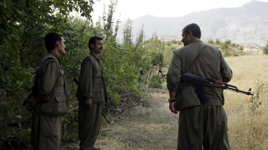 Fighters from a Kurdistan Workers Party (PKK)
camp stand guard during a news conference in the remote Qandil mountains near the Iraq-Turkish border in Sulaimaniya, 330 km (205 miles) northeast of Baghdad, August 13, 2010. Picture taken August 13, 2010. REUTERS/Stringer (IRAQ - Tags: POLITICS CIVIL UNREST) - GM1E68E1OH601