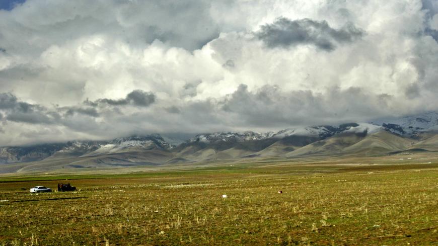 A general view of the mountains next to the town of Suleimaniya, some 330 km north of Iraqi capital Baghdad, January 31, 2004. North of the bombs and the chaos, the Kurdish city of Suleimaniya is worlds apart from the Iraq that dominates the headlines. Shops with bright neon signs and sharp window displays line wide, clean streets; traffic lights flash red and green; women walk unveiled through the city. At night the trees are hung with colored light bulbs, the restaurants full of diners. TO GO WITH STORY I