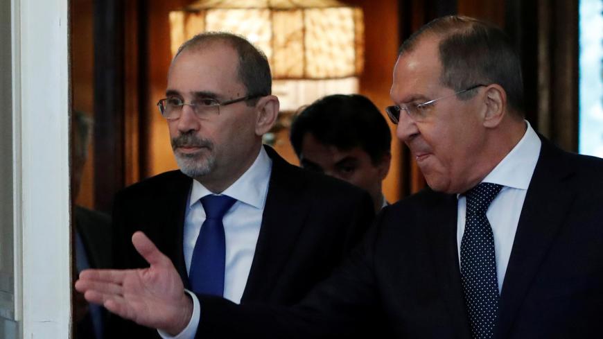 Russian Foreign Minister Sergei Lavrov and Jordanian Foreign Minister Ayman Safadi enter a hall during a meeting in Moscow, Russia July 4, 2018. REUTERS/Sergei Karpukhin - RC15A57E71B0