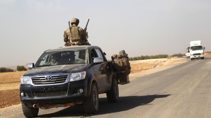 U.S. soldiers drive a military vehicle on the road connecting al-Rai town to Azaz city, northern Aleppo countryside, Syria October 4, 2016. REUTERS/Khalil Ashawi - S1BEUFBZQFAE