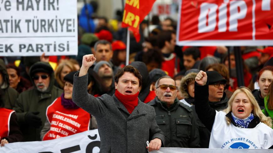 Demonstrators shout slogans during a protest against the government's plan to extend the state of emergency imposed after the 2016 coup attempt for another three months, in Istanbul, Turkey, January 14, 2018. REUTERS/Osman Orsal - RC199D207F30