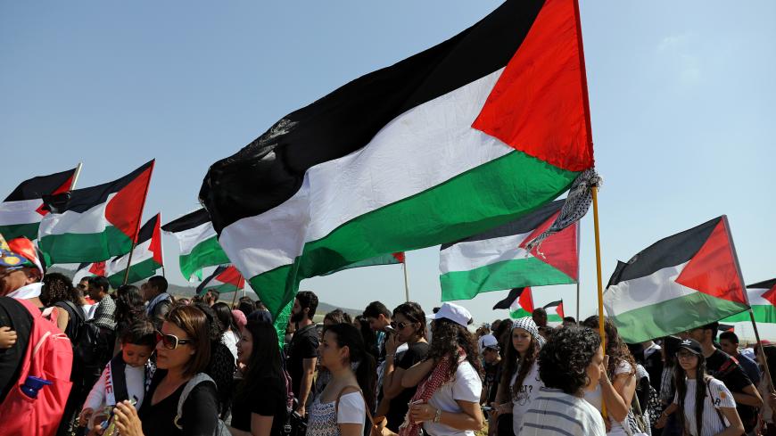 Israeli Arabs take part in a rally calling for the right of return for refugees who fled their homes during the 1948 Arab-Israeli War, near Atlit, Israel April 19, 2018. REUTERS/Ammar Awad - RC1850C38370