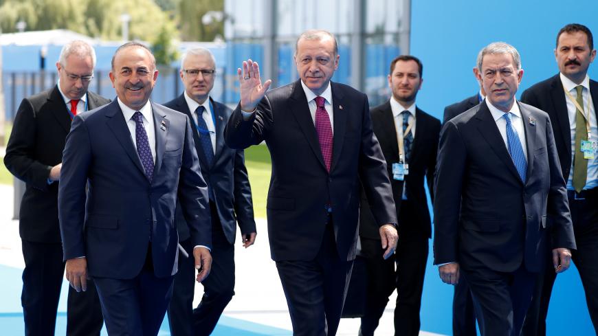 Turkish President Tayyip Erdogan and Foreign Minister Mevlut Cavusoglu arrive at the Alliance's headquarters ahead of the NATO summit in Brussels, Belgium July 11, 2018. REUTERS/Paul Hanna - RC1ACFF60500