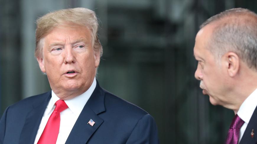 U.S. President Donald Trump talks to Turkeyís President Recep Tayyip Erdogan at NATO headquarters in Brussels, Belgium July 11, 2018. Tatyana Zenkovich/Pool via REUTERS - RC1B9A3C2D00