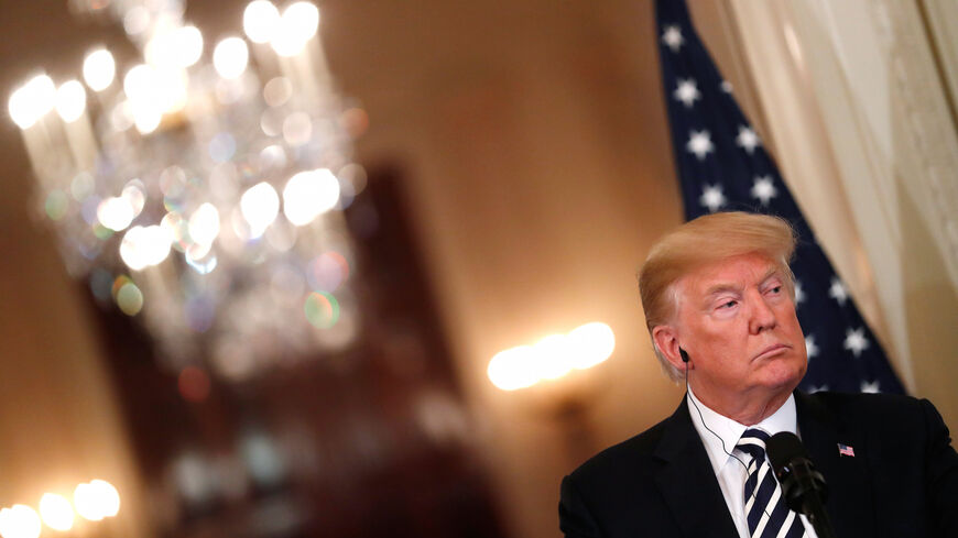 U.S. President Donald Trump listens to a question as he holds a joint news conference with Italy's Prime Minister Giuseppe Conte in the East Room of the White House in Washington, U.S., July 30, 2018. REUTERS/Carlos Barria - RC177B101AC0