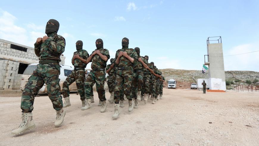 Fighters from the Jaysh al-Izza (the Army of Glory), affiliated with the Turkish-backed Free Syrian Army, take part in a training session in the northwestern Syrian city of Idlib on April 9, 2018. / AFP PHOTO / OMAR HAJ KADOUR        (Photo credit should read OMAR HAJ KADOUR/AFP/Getty Images)