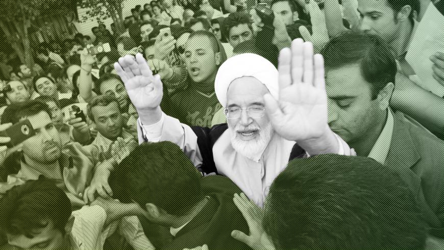 EDITORS' NOTE: Reuters and other foreign media are subject to Iranian restrictions on leaving the office to report, film or take pictures in Tehran.

Iran's presidential candidate Mehdi Karroubi (3rd R) joins a crowd of supporters in Tehran June 17, 2009. REUTERS/Demotix (IRAN POLITICS ELECTIONS CONFLICT) - GM1E56I0IW301