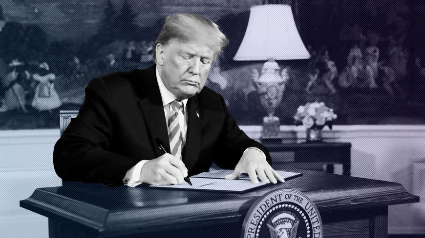 U.S. President Donald Trump signs a proclamation declaring his intention to withdraw from the JCPOA Iran nuclear agreement in the Diplomatic Room at the White House in Washington, U.S., May 8, 2018. REUTERS/Jonathan Ernst TPX IMAGES OF THE DAY - RC157E042900