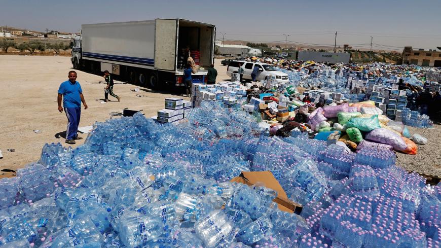 Humanitarian aid is prepared to be delivered to Syria, in the town of Ramtha, Jordan, July 2, 2018. REUTERS/Muhammad Hamed     TPX IMAGES OF THE DAY - RC12927A2020