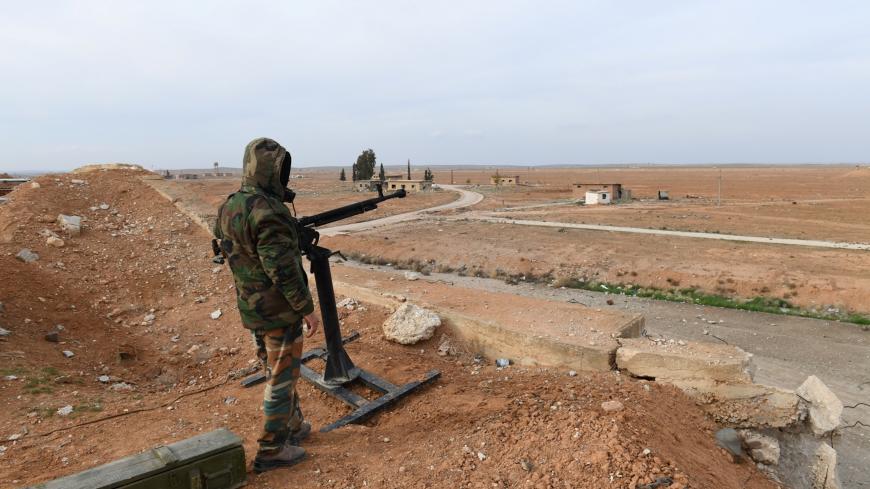 A Syrian Army soldier loyal to Syria's President Bashar al-Assad forces stands next to a military weapon in Idlib, Syria January 21, 2018. Picture taken January 21, 2018. SANA/Handout via REUTERS ATTENTION EDITORS - THIS PICTURE WAS PROVIDED BY A THIRD PARTY. REUTERS IS UNABLE TO INDEPENDENTLY VERIFY THE AUTHENTICITY, CONTENT, LOCATION OR DATE OF THIS IMAGE. - RC19C0D8B740
