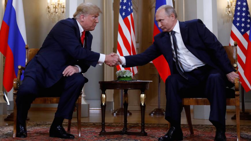 U.S. President Donald Trump and Russia's President Vladimir Putin shake hands as they meet in Helsinki, Finland July 16, 2018. REUTERS/Kevin Lamarque TPX IMAGES OF THE DAY - RC19BE6D3090