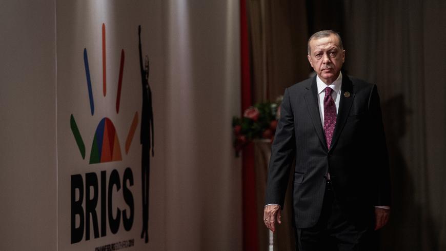 Turkey's President Tayyip Erdogan arrives for a group picture at the BRICS summit meeting in Johannesburg, South Africa, July 27, 2018. Gianluigi Guercia/Pool via REUTERS? - RC11D75C1B70