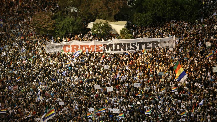Israelis from the Druze minority together with others take part in a rally to protest against Jewish nation-state law in Rabin square in Tel Aviv, Israel, August 4, 2018. REUTERS/Corinna Kern - RC1B986AEC80