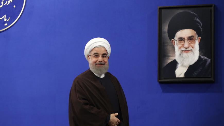 Newly re-elected Iranian President Hassan Rouhani gestures after delivering a televised speech in the capital Tehran on May 20, 2017. A portrait of Iran's Supreme Leader Ayatollah Ali Khamenei is seen in the background.
Iranians have chosen the "path of engagement with the world" and rejected extremism, President Hassan Rouhani said following his resounding re-election victory. / AFP PHOTO / ATTA KENARE (Photo credit should read ATTA KENARE/AFP/Getty Images)