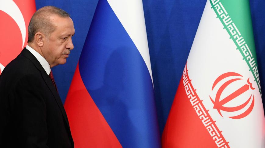Turkish President Tayyip Erdogan arrives for a news conference with President Hassan Rouhani of Iran and Vladimir Putin of Russia following their meeting in Tehran, Iran September 7, 2018. Kirill Kudryavtsev/Pool via REUTERS - RC1DC2377000