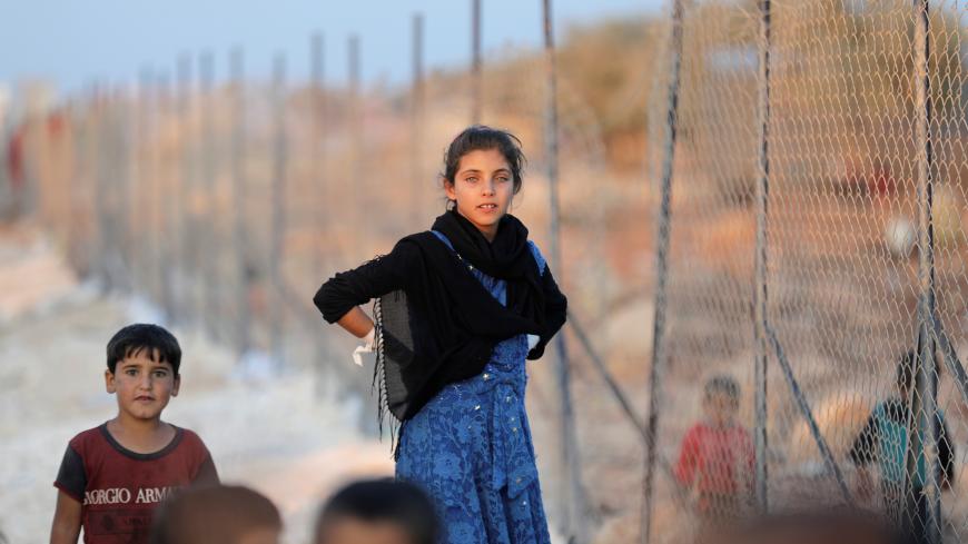 Newly displaced Syrian children arrive to a refugee camp in Atimah village, Idlib province, Syria September 11, 2018. REUTERS/ Khalil Ashawi - RC1969082B70
