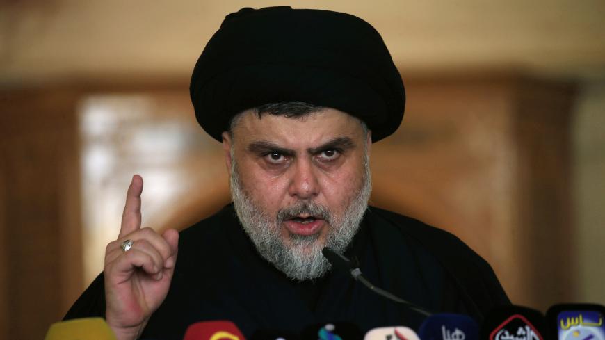 Iraqi Shi'ite radical leader Muqtada al-Sadr delivers a sermon to worshippers during Friday prayers at the Kufa mosque near Najaf, Iraq September 21, 2018.  REUTERS/Alaa Al-Marjani - RC160DC8C560