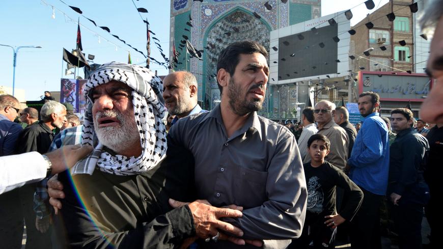 Men mourn during a funeral of the victims of assault that killed 25 people, in the streets of the southwestern Iranian city of Ahvaz, Iran September 24, 2018. Tasnim News Agency/via REUTERS ATTENTION EDITORS - THIS PICTURE WAS PROVIDED BY A THIRD PARTY. - RC1503357B50